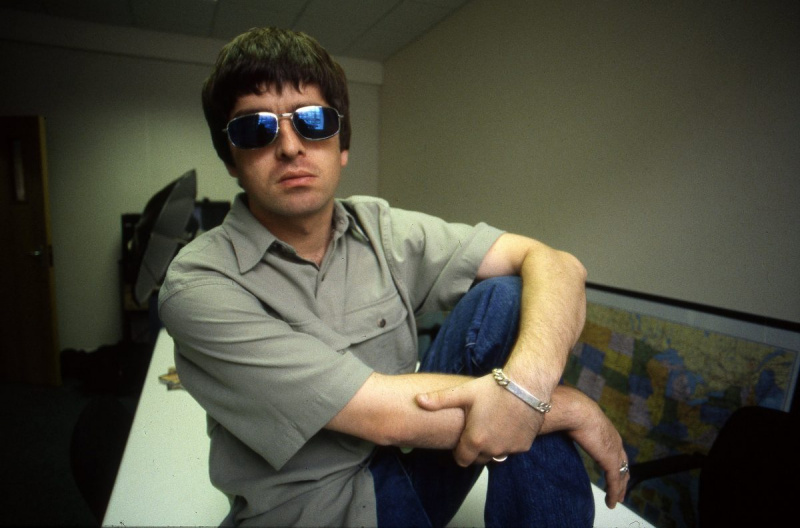   Oase' Noel Gallagher wearing glasses