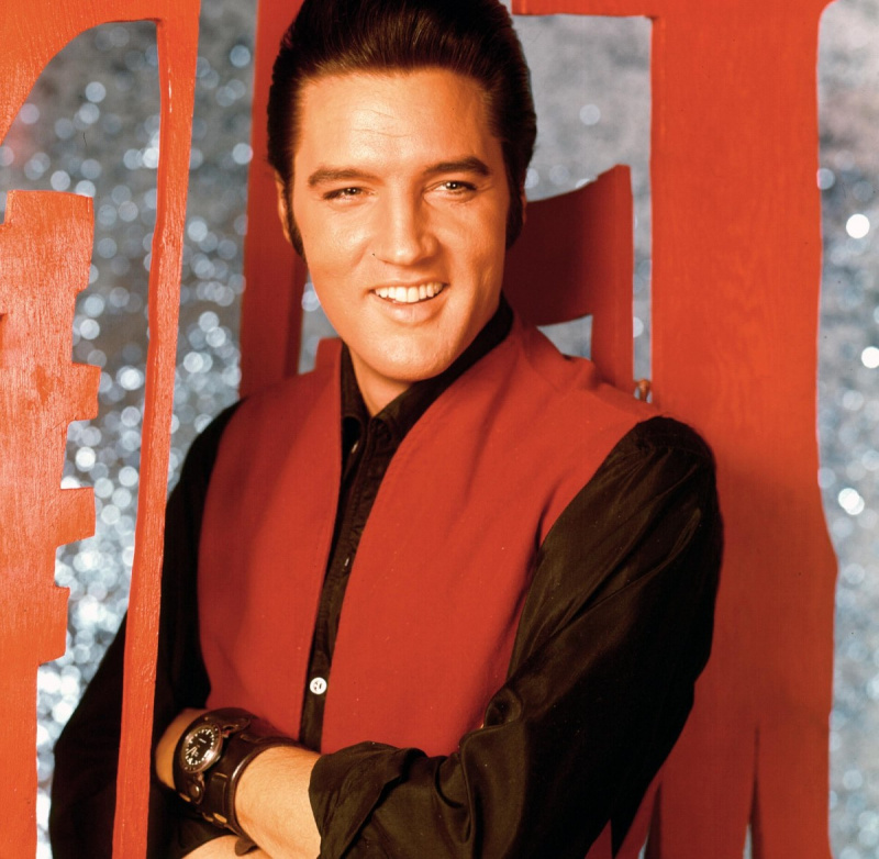   'Gali't Help Falling in Love" singer Elvis Presley wearing red